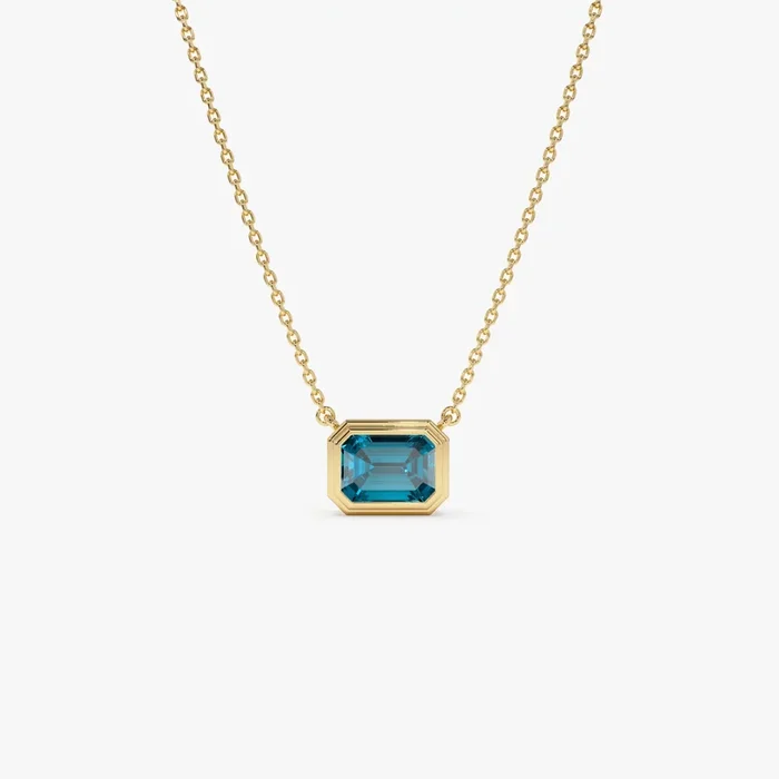 14K Gold 1.25 ctw Emerald Cut Bezel Setting Blue Topaz