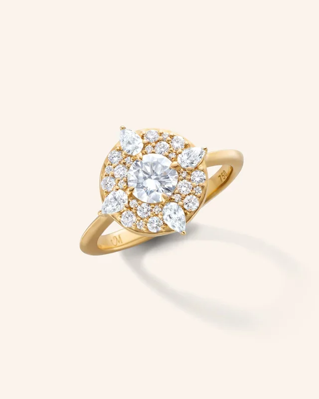 “Points North” Diamond Ring with Round and Pear Shaped Diamonds
