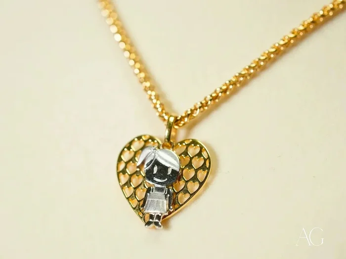 Golden Elegance: 18k Gold H Doll Pendant